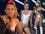 Show host Miley Cyrus shields herself on stage at the 2015 MTV Video Music Awards in Los Angeles, California August 30, 2015.  REUTERS/Mario Anzuoni