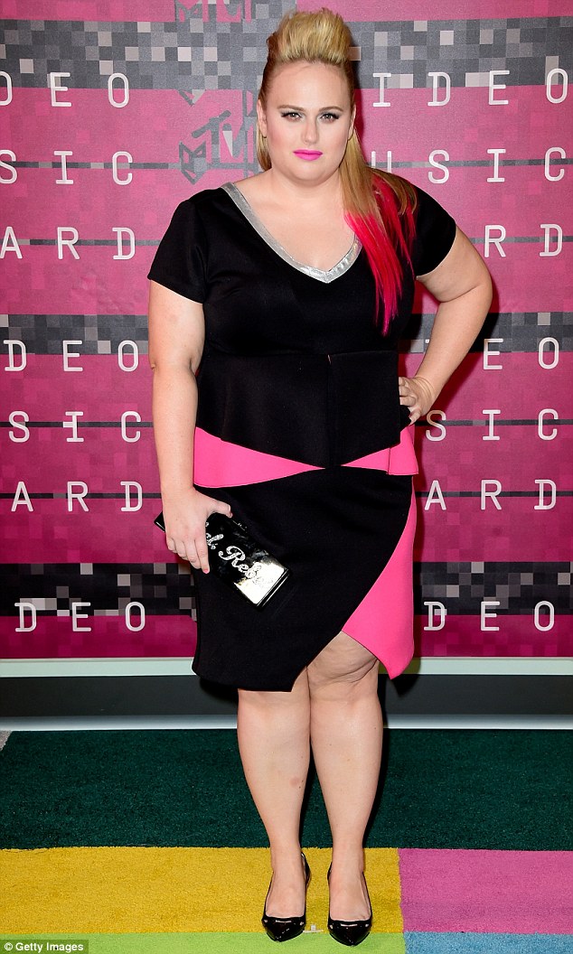 On fleek: Rebel slipped her curves into a black and pink top and matching skirt that featured a flattering peplum