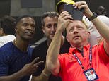 NEW YORK-SEP 02: Actor Jamie Foxx and coach Boris Becker take a selfie together after Novak Djokovic defeats Andreas Kaiden-Maurer (AUT) 64, 61, 62 during their opening round match of the 2015 US Open in Flushing Meadows, NY.

Pictured: Jamie Foxx and Boris Becker
Ref: SPL1115586  020915  
Picture by: Bigshots Photos / Splash News

Splash News and Pictures
Los Angeles: 310-821-2666
New York: 212-619-2666
London: 870-934-2666
photodesk@splashnews.com