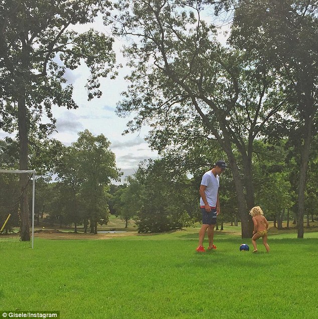 Back at it! Gisele Bundchen, 35, took to Instagram with a bonding father-daughter photo on Saturday, showcasing her hubby Tom Brady playing soccer outdoors with their two-year-old Vivian Lake