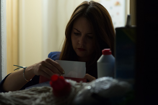 Stacey searches through Jean's things looking for clues. 