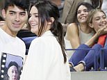 epa04921151 US television personality Kendall Jenner (L) and US model Gigi Hadid (R) watch as Venus Williams of the US plays Serena Williams of the US during their quarterfinals match on the ninth day of the 2015 US Open Tennis Championship at the USTA National Tennis Center in Flushing Meadows, New York, USA, 08 September 2015. The US Open runs through 13 September, which is a return to a 14-day schedule.  EPA/ANDREW GOMBERT