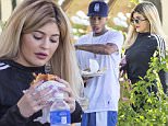 **NO WEB, MUST CALL FOR PRICING** *EXCLUSIVE* Calabasas, CA - Voluptuous Kylie Jenner hits up her local Johnny Rockets, along with boyfriend Tyga, on a beautiful Labor Day Weekend.  The two appear to be in the mood for a juicy burger and fries as they ate al fresco on the patio.  The newly-blonde youngest member of the Kardashian/Jenner clan wore a pair of black leggings and Adidas long-sleeved shirt that showed off her curvy figure, while Tyga wore his usual casual get-up consisting of a white t-shirt, gym shorts, and sneakers. According to reports, Tyga is reportedly "broke" and is reported to have leased Kylie Jenner's  white Lamborghini under her name. \nAKM-GSI       September 5, 2015\nTo License These Photos, Please Contact :\nSteve Ginsburg\n(310) 505-8447\n(323) 423-9397\nsteve@akmgsi.com\nsales@akmgsi.com\nor\nMaria Buda\n(917) 242-1505\nmbuda@akmgsi.com\nginsburgspalyinc@gmail.com