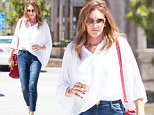 Caitlyn Jenner\nEXCLUSIVE TO INF. PLEASE CALL FOR PRICING.\nSeptember 8th, 2015:  Caitlin Jenner goes casual wearing a cape blouse and jeans as she makes a coffee run in Malibu, CA.\nMandatory Credit: SAA/INFphoto.com\nRef:infusla-301