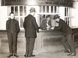 Customers at the counter of the London Joint City and Midland Bank.