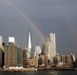 epa04923908 A rainbow over the One world trade center (Freedom Tower) and lower Manhattan in New York, New York, USA, 10 September 2015.  EPA/ANDREW GOMBERT