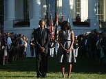 President Barack Obama and first lady Michelle Obama pause on the South Lawn of the White House in Washington, Friday, Sept. 11, 2015, as they observed a moment of silence to mark the 14th anniversary of the 9/11 attacks. (AP/Andrew Harnik)