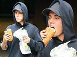 EXCLUSIVE: Justin Bieber spotted bitting a huge sandwich from subway while out and about in New York City\n\nPictured: Justin Bieber\nRef: SPL1121044  090915   EXCLUSIVE\nPicture by: Felipe Ramales / Splash News\n\nSplash News and Pictures\nLos Angeles: 310-821-2666\nNew York: 212-619-2666\nLondon: 870-934-2666\nphotodesk@splashnews.com\n