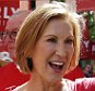 Republican presidential candidate Carly Fiorina, the former Hewlett-Packard chief executive waves as she and supporters march in the Labor Day parade Monday, Sept. 7, 2015, in Milford, N.H. (AP Photo/Jim Cole)
