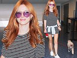 11.SEPT.2015 - LOS ANGELES - USA\n*STRICTLY AVAILABLE FOR UK AND GERMANY USE ONLY*\nACTRESS BELLA THORNE ARRIVES AT LAX AIRPORT TO CATCH A FRIDAY NIGHT FLIGHT OUT OF LOS ANGELES WITH HER POOCH. THE BEAUTIFUL ACTRESS ROCKED A STRIPED SHIRT DRESS AND WHITE SNEAKERS AS SHE WALKED HER DOG ON A LEASH INTO THE AIRPORT\nBYLINE MUST READ : XPOSUREPHOTOS.COM\n***UK CLIENTS - PICTURES CONTAINING CHILDREN PLEASE PIXELATE FACE PRIOR TO PUBLICATION ***\n*UK CLIENTS MUST CALL PRIOR TO TV OR ONLINE USAGE PLEASE TELEPHONE 0208 344 2007*