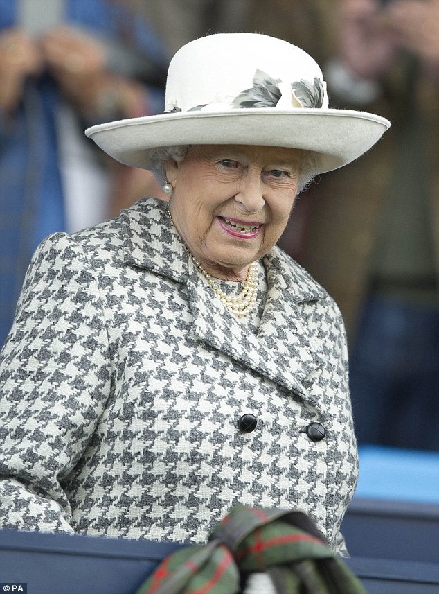 Resplendent in a houndstooth grey and white coat, the Queen smiled as she attended one of her favourite events - a horse show in Scotland