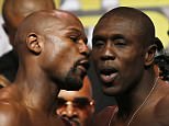 Mayweather whispers something in Berto's ear ahead of the welterweight title bout on Saturday&nbsp;