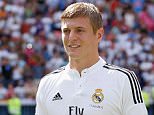MADRID, SPAIN - JULY 17:  (SPAIN OUT) Toni Kroos poses for photographers in his new Real Madrid shirt during his official unveiling at Santiago Bernabeu Stadium on July 17, 2014 in Madrid, Spain. Toni Kroos who won the World Cup with Germany in Brazil is Real Madrid's first signing in the new season.  (Photo by Pablo Blazquez Dominguez/Getty Images)