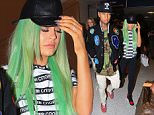 Kylie Jenner and boyfriend Tyga seen at Los Angeles airport arriving back from NY.  

Pictured: Kylie Jenner and Tyga
Ref: SPL1129089  170915  
Picture by: Splash News

Splash News and Pictures
Los Angeles: 310-821-2666
New York: 212-619-2666
London: 870-934-2666
photodesk@splashnews.com