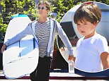 Orlando Bloom took his son Flynn out to the surf shop in Malibu as he picked out a new longboard, on Saturday, September 19, 2015. X17online.com