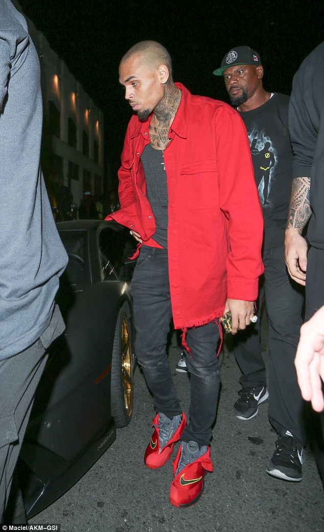 In the red: Chris Brown was given a ticket by a police officer on Friday after illegally parking his Lamborghini outside a club in Hollywood