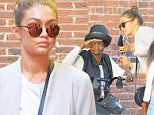 Gigi Hadid seen walking in SoHo, she gets stopped by an elderly lady in the middle of her walk\n\nPictured: Gigi Hadid\nRef: SPL1130563  180915  \nPicture by: Gachie / Splash News\n\nSplash News and Pictures\nLos Angeles: 310-821-2666\nNew York: 212-619-2666\nLondon: 870-934-2666\nphotodesk@splashnews.com\n