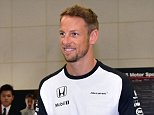 McLaren Honda driver Jenson Button (C) rides Honda's personal mobility Unicab upon his arrival for a meeting with fans at the Honda headquarters in Tokyo on September 23, 2015. The Japanese Grand Prix will be held at the Suzuka circuit in Mie prefecture from September 25-27.  AFP PHOTO / Yoshikazu TSUNOYOSHIKAZU TSUNO/AFP/Getty Images