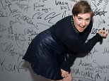 Lena Dunham signs the wall at AOL Studios after participating in AOL's BUILD Speaker Series on Thursday, Sept. 24, 2015, in New York. (Photo by Charles Sykes/Invision/AP)
