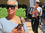 Amber Rose is spotted shopping in Beverly Hills, wearing an off-the-shoulder sweatshirt and workout pants. The only dash of color is her bright pink keychain. Friday, September 25, 2015  X17online.com