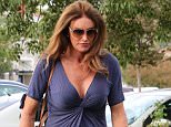 Caitlyn Jenner grabs coffee with a much shorter man in Malibu. Cait wearing a low cut blue dress, heels and sunglasses. After getting coffee, Caitlyn goes to see a movie by herself  September 21, 2015 X17online.com