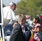 Pope Francis reaches for a child during a papal parade in Washington September 23, 2015. Pope Francis is making his first visit to the United States. REUTERS/Alex Brandon/Pool

Sophie Cruz
