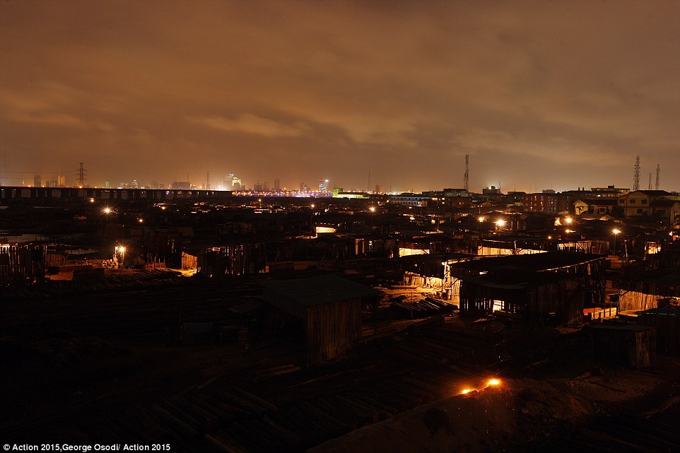Makeshift wooden structures seen at  night at the Okobaba slum at the Lagos Lagoon waterfront, where residents awaits eviction with anguish as the area has been marked for demolition by the state government