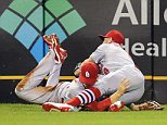 Sep 28, 2015; Pittsburgh, PA, USA; St. Louis Cardinals left fielder Stephen Piscotty (left) and center fielder Peter Bourjos (8) collide making a catch on a ball hit by Pittsburgh Pirates third baseman Josh Harrison (not pictured) during the seventh inning at PNC Park. Piscotty  was taken from the game on a stretcher. Mandatory Credit: Charles LeClaire-USA TODAY Sports