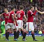 Manchester United's Wayne Rooney, second right, celebrates with teammates after scoring during the English Premier League soccer match between Manchester United and Sunderland at Old Trafford Stadium, Manchester, England, Saturday, Sept. 26, 2015. (AP Photo/Jon Super)