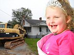 EXCLUSIVE: **PREMIUM EXCLUSIVE RATES APPLY**Mystery surrounded the fate of reality TV star Honey Boo Boo's old family home in rural Georgia, as diggers moved in on Monday morning (sept 28). Workers were seen ripping down a small, dilapidated former library that sits right next to one of reality TV's most famous houses, where the 'Here Comes Honey Boo Boo' clan filmed four seasons of their hit TLC show before it was sensationally axed amid a child abuse scandal. But it wasn't yet clear whether the family house itself, in the tiny town of McIntyre, would also be demolished. Alana's father Mike 'Sugar Bear' Thompson was seen at the three-bed property, which was recently listed for $45k. June 'Mama June' Shannon moved the family to Hampton, Georgia, when the show ended earlier this year but Sugar Bear still lives close by. Mama June said she was under the impression the house would be torn down, adding: "There are a lot of great memories for the whole family from our time at that house."