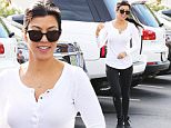 Please contact X17 before any use of these exclusive photos - x17@x17agency.com   Kourtney Kardashian shows off her trim and sexy physique in a tight white top during her outing at Coffee Bean with daughter Penelope. September 28, 2015 X17online.com EXCLUSIVE
