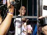 DENPASAR, BALI, INDONESIA - APRIL 21:  Heather Mack, 19, of the United States holds her baby daughter in jail after her verdict hearing on April 21, 2015 in Denpasar, Bali, Indonesia. An Indonesian judge has sentenced Heather Mack to 10 years and her boyfriend Tommy Schaefer to 18 years in jail after they were found guilty of murdering Mack's mother, Sheila von Wiese-Mack, whose body was found stuffed inside a suitcase in the back of a taxi outside a luxury Bali hotel in August 2014. (Photo by Agung Parameswara/Getty Images)