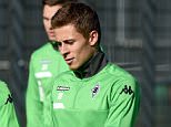 Moenchengladbach's Belgian midfielder Thorgan Hazard (R) and Moenchengladbach's Guinean midfielder Ibrahima Traore chat during a training session on the eve of the Group D, first-leg UEFA Champions League football match Borussia Moenchengladbach vs Manchester City FC in Moenchengladbach, western Germany on September 29, 2015. AFP PHOTO / PATRIK STOLLARZPATRIK STOLLARZ/AFP/Getty Images