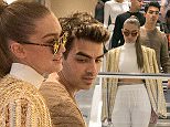 PARIS, FRANCE - OCTOBER 01:  (L-R) Gigi Hadid and Joe Jonas are seen shopping at the 'COLETTE' store on October 1, 2015 in Paris, France.  (Photo by Marc Piasecki/GC Images)