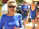 UK CLIENTS MUST CREDIT: AKM-GSI ONLY
EXCLUSIVE: Beverly Hills, CA - Actress Sharon Stone shows plenty of skin as she is spotted headed to a Beverly Hills restaurant in a sexy royal blue dress.  Sharon showed off her enviable figure in a backless fitted dress and shows us that at 57, you can still flaunt it if you've got it!

Pictured: Sharon Stone
Ref: SPL1139888  290915   EXCLUSIVE
Picture by: AKM-GSI / Splash News