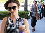 Beverly Hills, CA - Lily Collins is in a good mood as she shops in Beverly Hills wearing comfy pants paired with a sheer gingham top. The actress and daughter of Phil Collins sips on an iced coffee in the Los Angeles heat. \nAKM-GSI      October  1, 2015\nTo License These Photos, Please Contact :\nSteve Ginsburg\n(310) 505-8447\n(323) 423-9397\nsteve@akmgsi.com\nsales@akmgsi.com\nor\nMaria Buda\n(917) 242-1505\nmbuda@akmgsi.com\nginsburgspalyinc@gmail.com