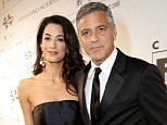 George Clooney (R) and Amal Alamuddin attend the Celebrity Fight Night gala celebrating Celebrity Fight Night In Italy benefitting The Andrea Bocelli Foundation and The Muhammad Ali Parkinson Center on September 7, 2014 in Florence, Italy.  (Photo by Rachel Murray/Getty Images for Celebrity Fight Night)