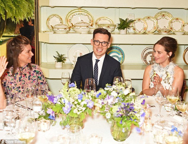 What a setting: Natalie Massenet, sat the other side of Erdem at the VIP table laden with flowers