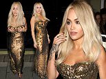 Rita Ora seen arriving at sexy fish restaurant in a sparkly gold dress ahead of her performance.\nFeaturing: Rita Ora\nWhere: London, United Kingdom\nWhen: 09 Oct 2015\nCredit: WENN.com
