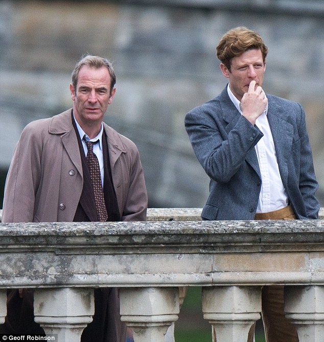 Dream team: The handsome duo, who play Detective Inspector Geordie Keating and Reverend Sidney Chambers respectively, were enjoying a coffee on the picturesque Clare College Bridge at the time