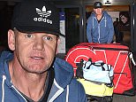 EXCLUSIVE Gordon Ramsay returns home to london after he had to be rescued by medical crews after suffering severe dehydration during an Ironman event.
The celebrity chef was competing in the 2015 Ironman World Championship in Hawaii when he fell violently ill.
seen arriving back at heathrow airport with his custom made bicycle.
13 October 2015.
Please byline: Neil Warner - Vantagenews.com