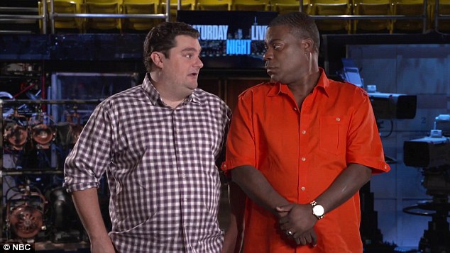 Fun on set: During the SNL promo, the 46-year-old joked about his plans to 'get everyone in this building pregnant,' as well as memory loss; pictured with Bobby on set