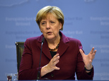 German Chancellor Angela Merkel talks to the media at a press conference after the EU summit in Brussels, Belgium on early Friday, Oct. 16, 2015. European Un...