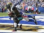 Hurns makes an eight-yard touchdown reception against the Colts' Darius Butler in Indianapolis