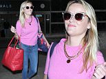 Los Angeles, CA - Reese Witherspoon takes a page out of her "Legally Blonde" character as she sports a cotton candy pink blouse paired with skinny denim jeans and an oversized bright red totebag.  The blonde beauty is seen arriving at LAX and appeared to be having a great day. \n  \nAKM-GSI      October 16, 2015\nTo License These Photos, Please Contact :\nSteve Ginsburg\n(310) 505-8447\n(323) 423-9397\nsteve@akmgsi.com\nsales@akmgsi.com\nor\nMaria Buda\n(917) 242-1505\nmbuda@akmgsi.com\nginsburgspalyinc@gmail.com