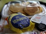 FAIRFIELD, CA - JULY 23:  A McDonald's "Big Breakfast" and Egg McMuffin are displayed at a McDonald's restaurant on July 23, 2015 in Fairfield, California.  McDonald's has been testing all-day breakfast menus at select locations in the U.S. and could offer it at all locations as early as October.  (Photo illustration by Justin Sullivan/Getty Images)