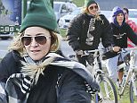 EXCLUSIVE: **PREMIUM EXCLUSIVE RATES APPLY*Madonna enjoys a day off from her 'Rebel Heart' tour in Vancouver with a brisk cycling workout at Stanley Park. The waterfront park is a must-do for tourists in the city, and it looks like Madge is making the most of her stay in the city. Flanked by tour staff, the group cycled at a brisk pace.\n\nPictured: Madonna,\nRef: SPL1152656  161015   EXCLUSIVE\nPicture by: Splash News\n\nSplash News and Pictures\nLos Angeles: 310-821-2666\nNew York: 212-619-2666\nLondon: 870-934-2666\nphotodesk@splashnews.com\n
