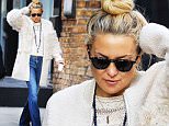 Kate Hudson in Tribecca in denim flare jeans, cream colored top, blue beads across her neck and hair tied up in a bun holding a coffee cup on one hand on Sunday October 18th, 2015. Non-Exclusive / Luis Yllanes / Splash News\n\nPictured: Kate Hudson\nRef: SPL1153804  181015  \nPicture by: Luis Yllanes / Splash News\n\nSplash News and Pictures\nLos Angeles: 310-821-2666\nNew York: 212-619-2666\nLondon: 870-934-2666\nphotodesk@splashnews.com\n