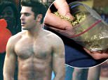 Picture Shows: Zac Efron  September 22, 2015.. .. ***MINIMUM MAG PRINT USAGE FEE £150 PER IMAGE***.. .. Actor Zac Efron shows off his best 'Magic Mike' moves while on the set of 'Neighbors 2' in Atlanta, Georgia. .. .. Zac jumped up on a table and stripped down and danced before revealing just a small pair of orange shorts. Zac then reached down the front of his shorts to help cover up his goods. Zac didn't let the smoke from BBQ grills disrupt his dance moves... .. ***MINIMUM MAG PRINT USAGE FEE £150 PER IMAGE***.. .. Exclusive All Rounder.. UK RIGHTS ONLY.. FameFlynet UK © 2015.. Tel : +44 (0)20 3551 5049.. Email : info@fameflynet.uk.com