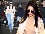 Kendall Jenner was at LAX, trailing a long flowing jacket, as fans and celebrity photographers, rush to catch a glimpse of the rising supermodel, on Saturday, October 17, 2015. X17online.com\\nOK FOR WEB SITE AT 20PP\\nMAGAZINES NORMAL FEES\\nAny queries please call Lynne or Gary on office 0034 966 713 949 \\nGary mobile 0034 686 421 720 \\nLynne mobile 0034 611 100 011\\nAlasdair mobile  0034 630 576 519